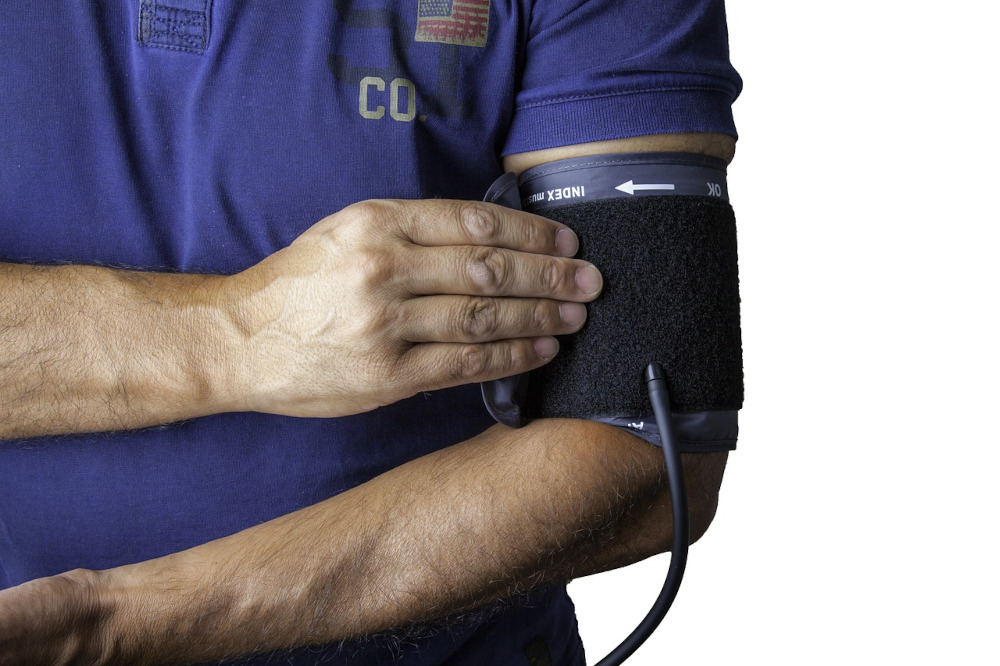 blood pressure cuff on arm